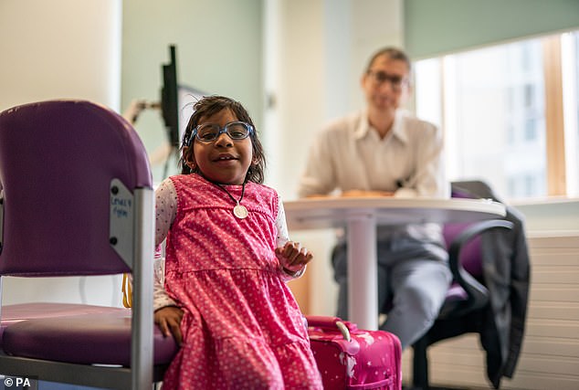 Professor Stephen Marks, pediatric kidney specialist, pictured with Aditi during a post-transplant appointment.  Experts from the kidney, immunology and stem cell transplant teams at Gosh worked with international colleagues to develop a treatment plan, which involved a double transplant of bone marrow and kidneys.