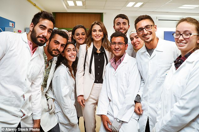 Queen Rania shows off her impeccable sense of style in an off-white pantsuit at the German-Jordanian university in May 2016