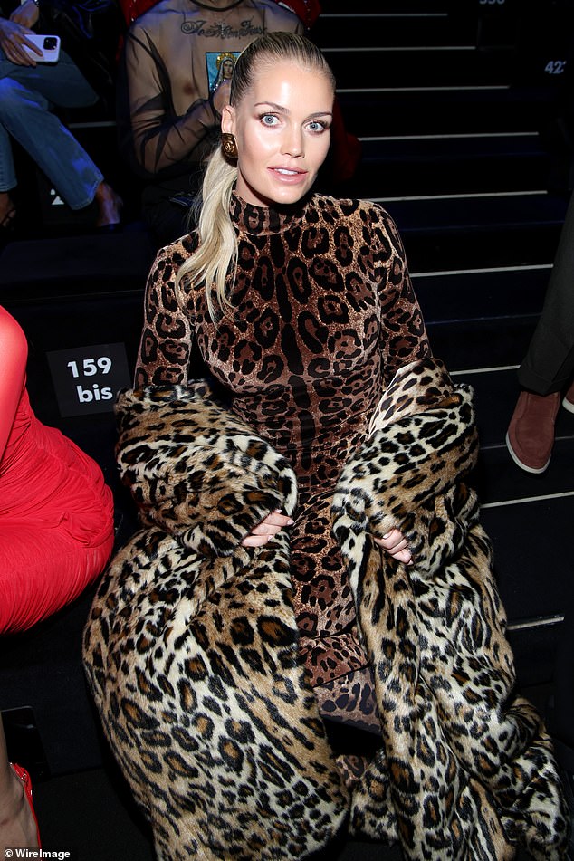 Striking: The model, 32, wore a matching animal print jacket over her shoulders and let her outfit do the talking, while keeping her accessories very minimal