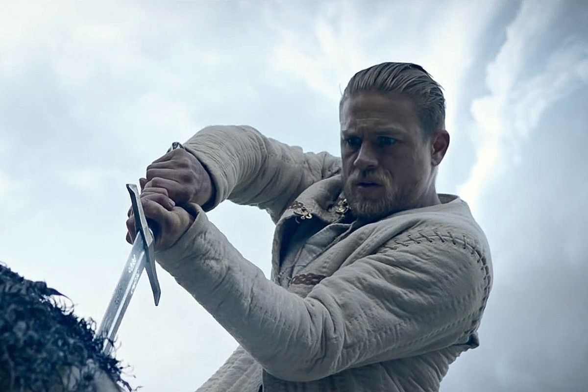 Charlie Hunnam as Arthur who pulls Excalibur from the stone in King Arthur: Legend of the Sword.