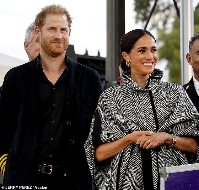 Prince Harry and Meghan Markle were all smiles as they made a surprise appearance on Kevin Costner's 'One805 Live!'  charity event