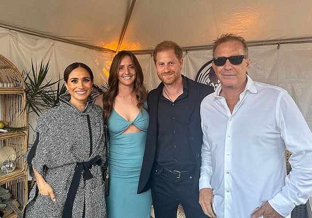 Meghan and Harry pictured backstage with presenter Kevin Costner