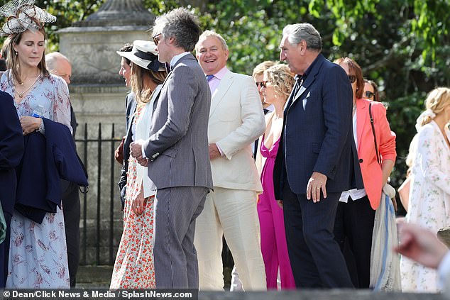 Chuckling Hugh Bonneville (pictured center) also played in Notting Hill and Paddington