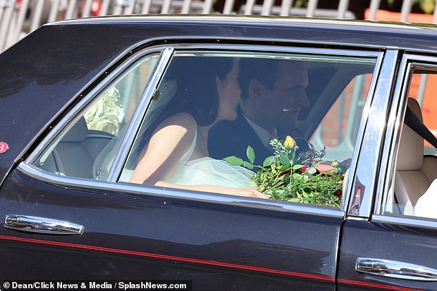 Michelle Dockery and Jasper Waller-Bridge drove away with a vibrant bouquet in hand