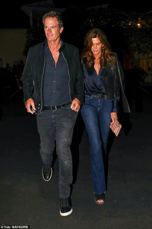 Holding hands: After their date night, the supermodel, 57, could be seen gazing adoringly at her husband, 61, as they walked back to their car