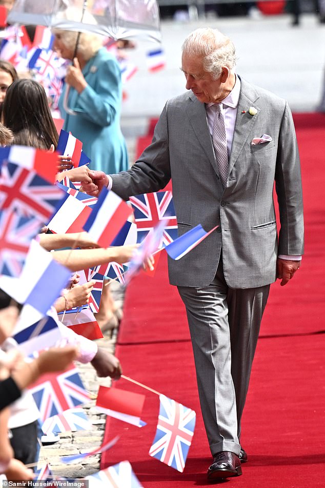 King Charles, pictured during his state visit to France this week, has commissioned Paul Whybrow to search the Queen's private papers a year after his mother's death