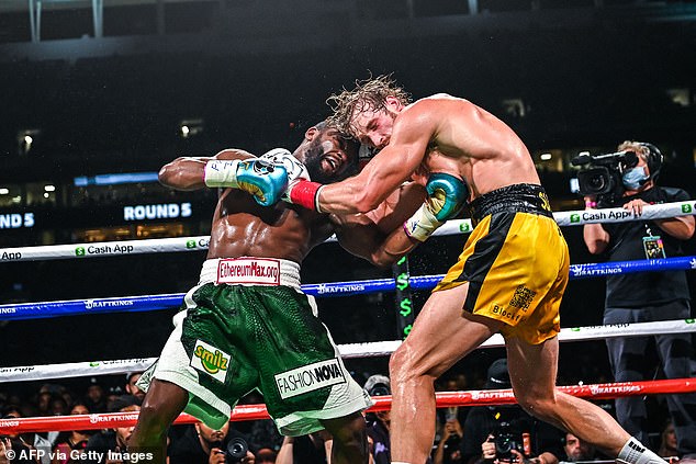 As the Sweet Science has faded into the cold shadow of Mixed Martial Arts over the past twenty years, a few shameless opportunists have co-opted the noble art to enhance their eccentricities and bolster their bottom lines.  (Above) Former world welterweight king Floyd Mayweather (L) and Logan Paul (R) fight in an eight-round exhibition bout at Hard Rock Stadium in Miami, Florida on June 6, 2021