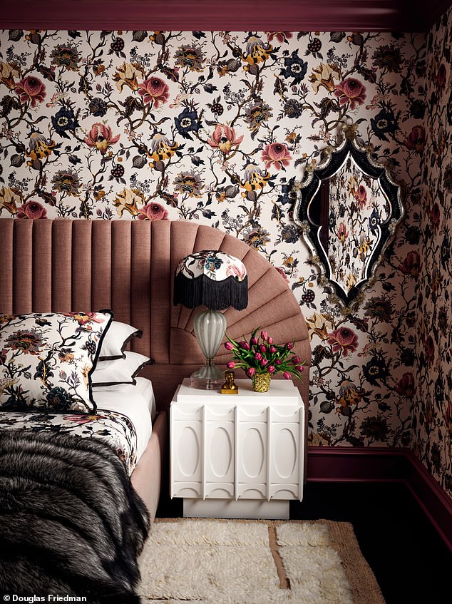 A fluted sunrise headboard, Murano glass lamps and bold floral Artemis wallpaper from houseofhackney.com give this guest room a 1920s vibe.  Try jonathanadler.com for a similar nightstand