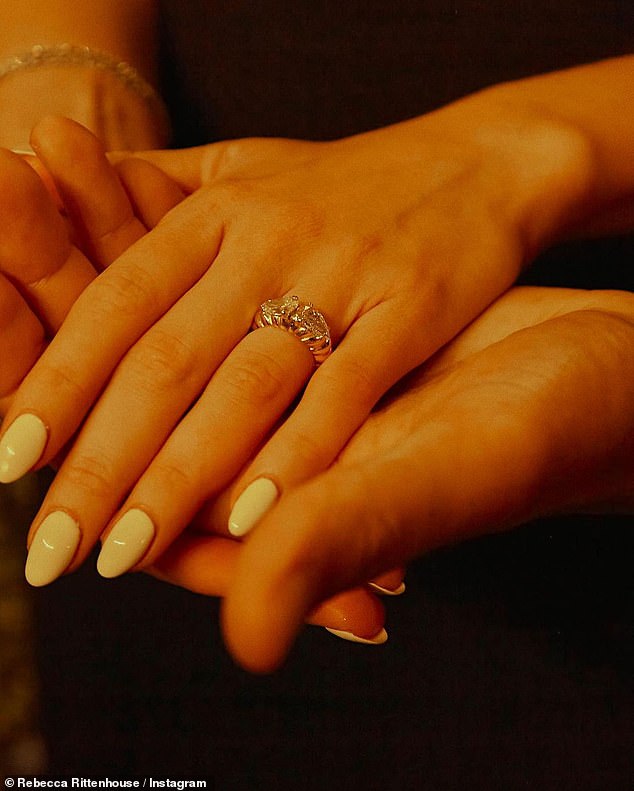 Diamond ring: Finally, Rebecca shared a close-up photo of her engagement ring as her hand rested gently on her fiancé's