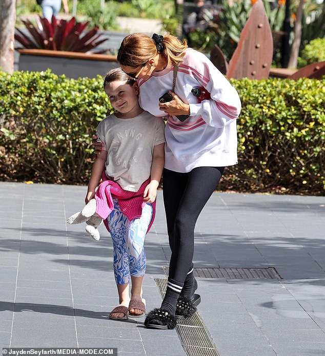 Kyle looked every bit the loving mother as she walked with one arm around her daughter as the couple walked down the scenic street