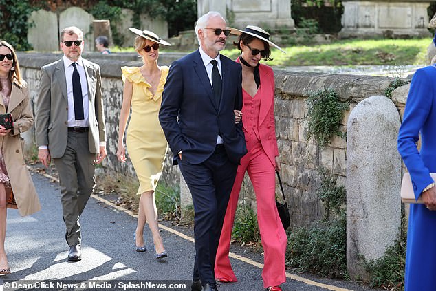 Michelle's now sister-in-law Phoebe wore a stunning bright pink three-piece suit to the wedding she attended with her partner Martin MacDonagh, an Irish playwright