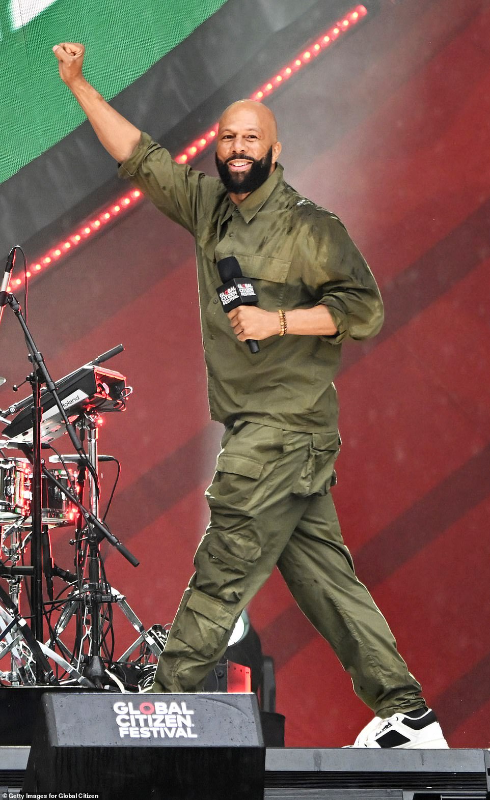 Famous face: Common was also at the festival, rocking the stage in an olive green co-ord set