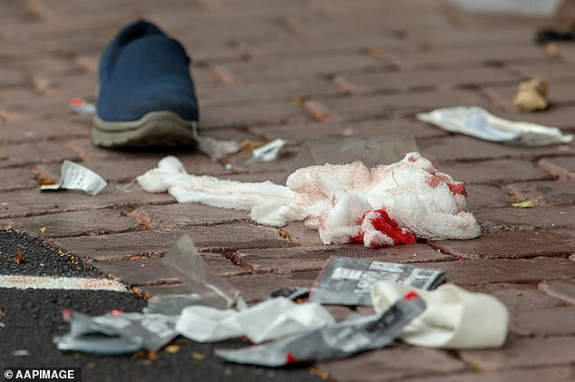 Bloodied bandages are seen on the road after the Masjid Al Noor mosque shooting in Christchurch on March 15, 2019.