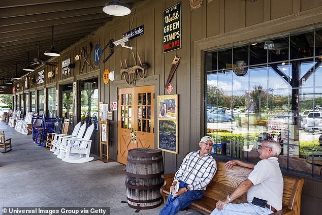 Customers are seen outside a Cracker Barrel.  Even the rocking chairs for the restaurant are for sale