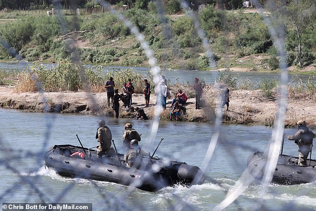 Exclusive photos from DailyMail.com show the group was involved in a standoff with Border Patrol and National Guard boats circling and blocking them as they tried to cross