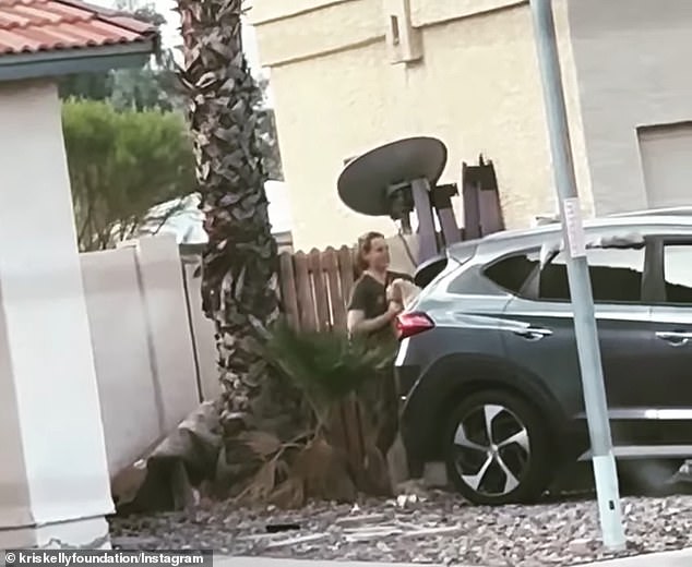 April Addison is seen in a video leaving her home with a dog in Chandler, Arizona