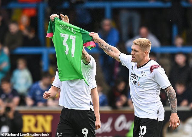 Vickers' Rams teammates held up his strip after he opened yesterday's match with a goal