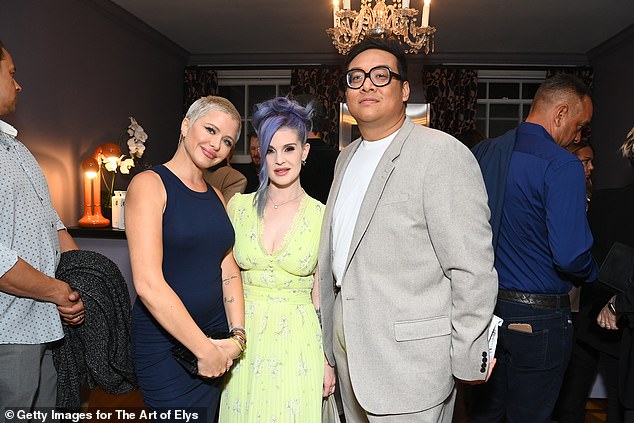 Friends: In another photo, the beauty is seen smiling as she put her arm around TV personality Laura Rugetti and tennis player Daniel Nguyen