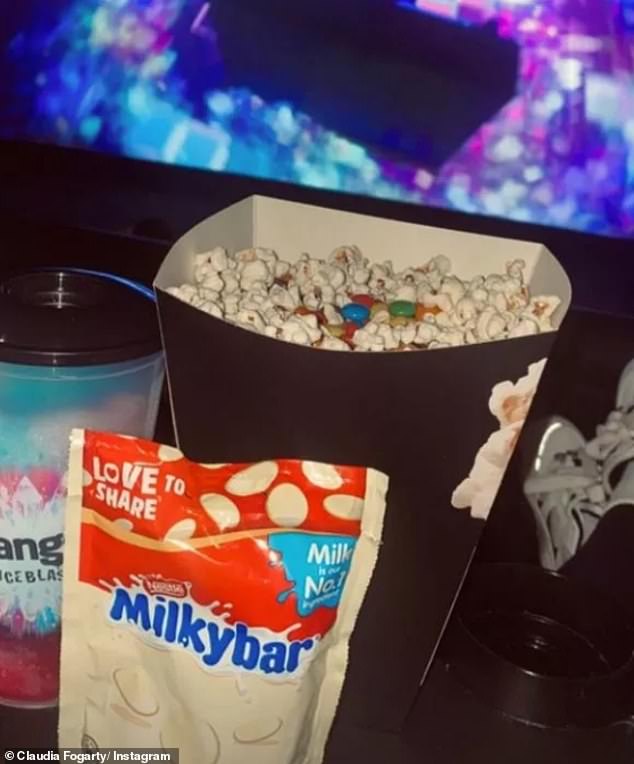 Hoping for a Hollywood ending: Claudia confirmed on Instagram that she had been on a fun cinema date with the footballer by sharing a photo of their popcorn and sweets