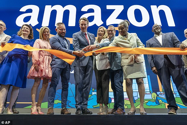 Virginia Governor Glenn Youngkin is seen with Amazon executives during a grand opening ceremony at Amazon's second headquarters, HQ2, in Arlington on June 15