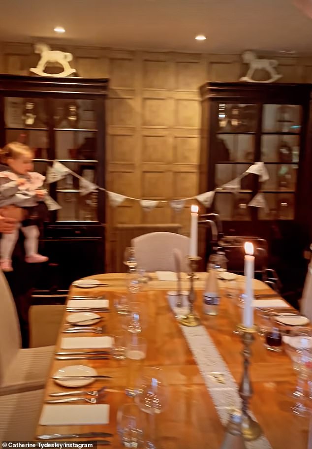 Dinner setting: Catherine also shared a photo of their private dining room, which was decorated with bunting and aluminum foil 