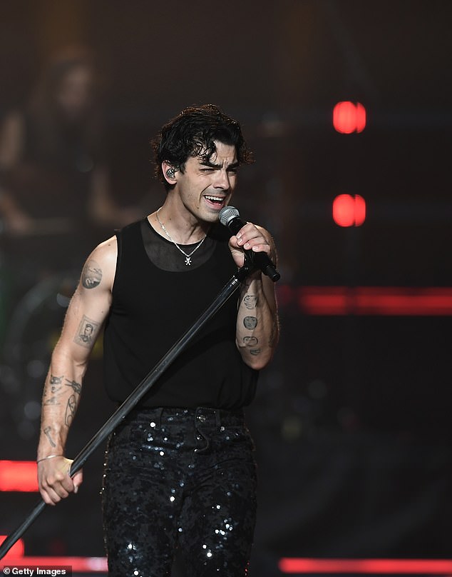 Tough time: Joe Jonas gave a shout-out to fellow parents during a Jonas Brothers performance last week – amid his explosive custody battle with estranged wife Sophie Turner (pictured September 8)