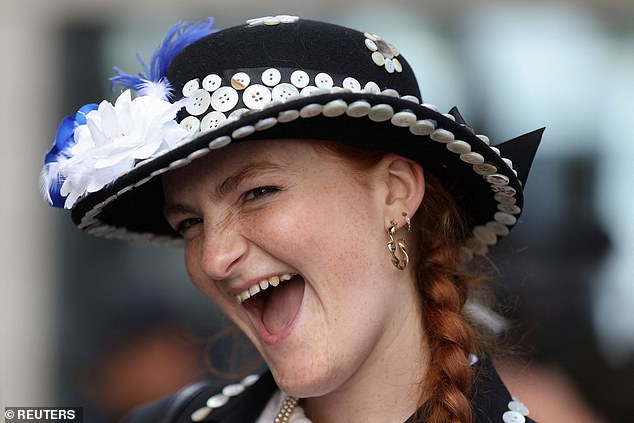 A fundraiser looked delighted as she supported the festival in a dazzling hat