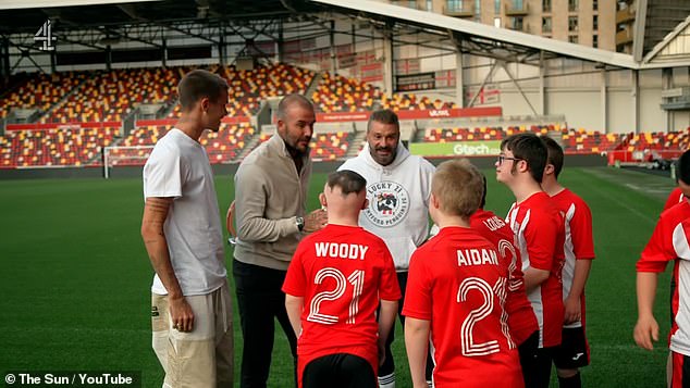 Inspirational: In addition to the Who Cares Wins awards, the Beckhams visited the football club to personally present coach Allan with the award and speak to the children at the club