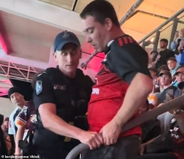 The heated situation was resolved when a Queensland police officer escorted the man to the scene (pictured)