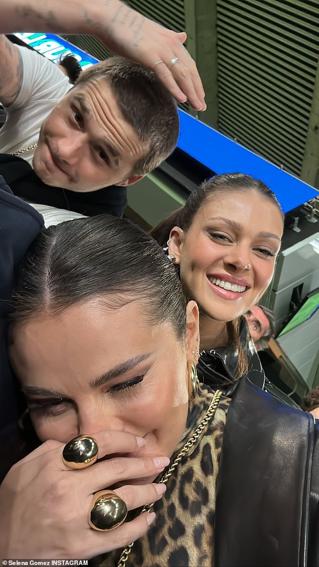 Having fun: On the same day, the Single Soon singer posted a photo of herself giggling uncontrollably with Nicola and her husband, Brooklyn Beckham, 24, during the sports competition