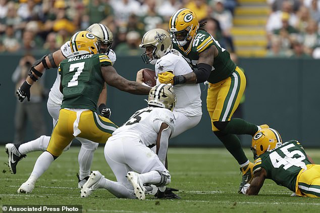 Carr was sacked by Green Bay defenseman Rashan Gary, who knocked him to the ground