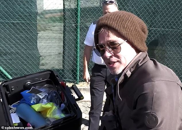 Brad's appearance: Pitt was spotted wearing a brown and green plaid shirt under a brown jacket, a brown stocking cap and brown sunglasses, with black pants and black shoes