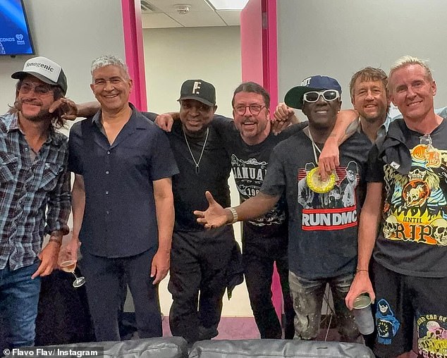 Respect: Backstage, Flav and Chuck bonded with rock superstars Foo Fighters, which was documented with a photo of the guys all arm in arm with Chuck and Dave Grohl in the middle