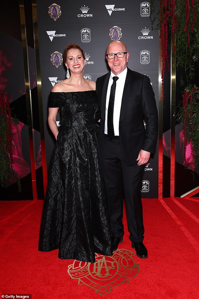 AFL Executive General Manager Brian Walsh enjoyed a date night with Julia Edwards, who looked glamorous in a beautiful off-the-shoulder black gown