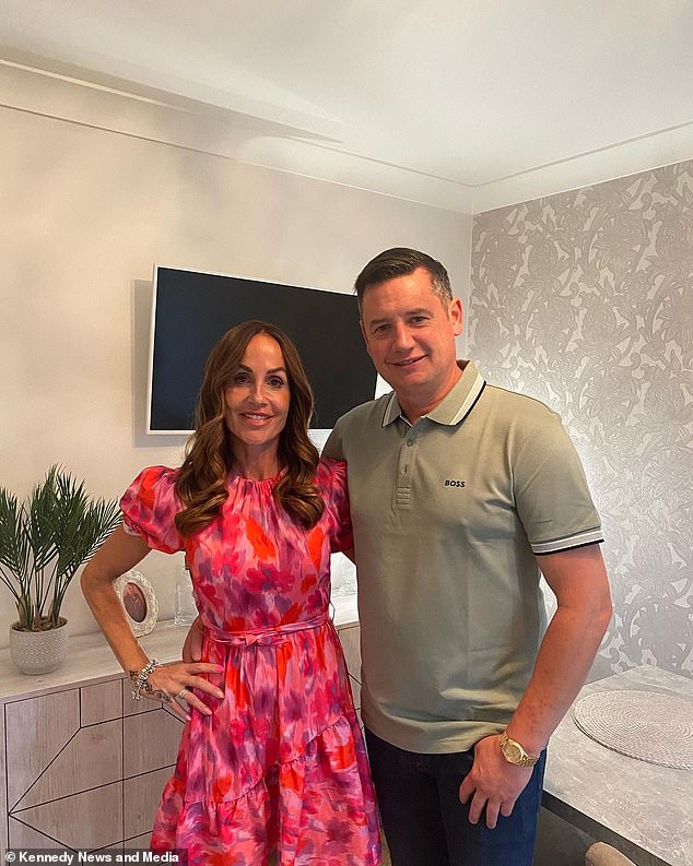 Despite the scare, the 48-year-old couldn't give up her 30-year tanning habit and 'played with fire' by having a tanning session almost every week to maintain her golden glow (pictured with her partner Ian Jones)