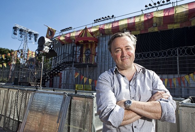 Back with a bang: Legendary Big Brother narrator Marcus Bentley, 55, has reportedly re-applied for the job on the show's upcoming reboot (Marcus is pictured outside the Big Brother house during the latest Channel 4 series in 2010)