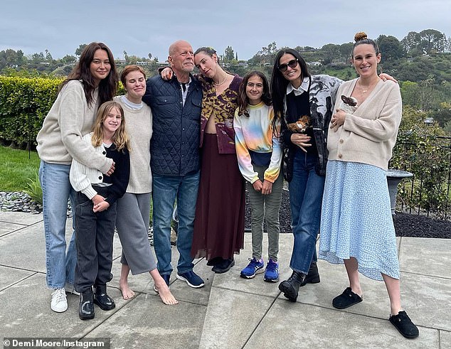 Family man: Bruce pictured with his entire family, including his ex-wife Demi Moore and their daughters Rumer, Scout and Tallulah