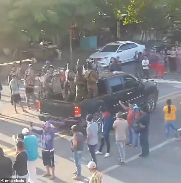 Gunmen from the Sinaloa cartel were greeted with applause and cheers during a parade in Chiapas, across the border with Guatemala, on Saturday