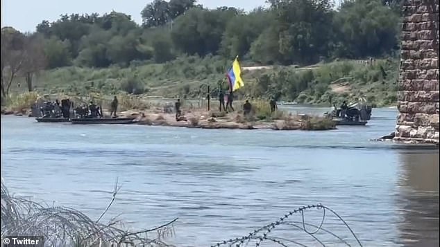 Texas Department of Public Safety officials are seen taking down the Venezuelan flag