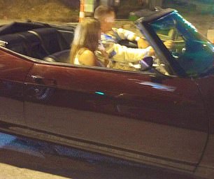 Taylor and Travis left the stadium together and then drove off into the night in a convertible