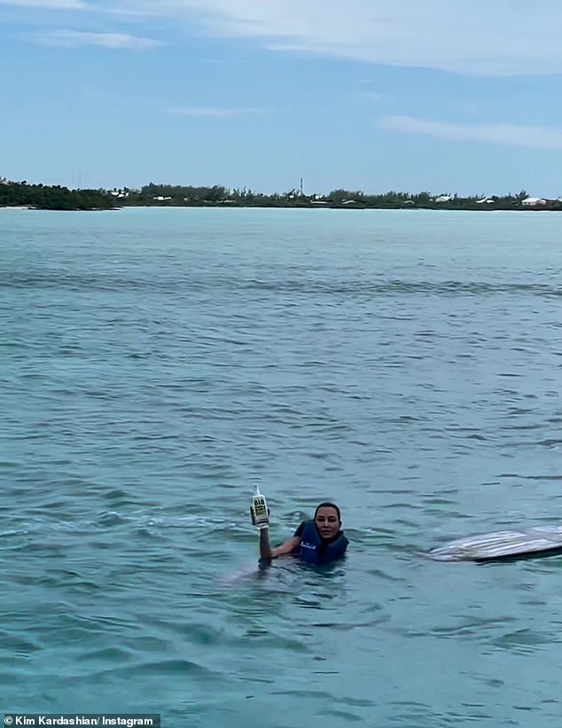 She persevered: Kim proved to be a wakeboard warrior as she held Kendall's tequila like a pro