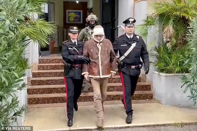 Denaro, the country's most wanted mafia boss, is escorted out of a Carabinieri police station after being arrested in Palermo, Italy on January 16, 2023