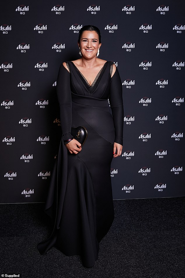 Laura Kane looked elegant in a black dress with long sleeves and a detailed V-neck