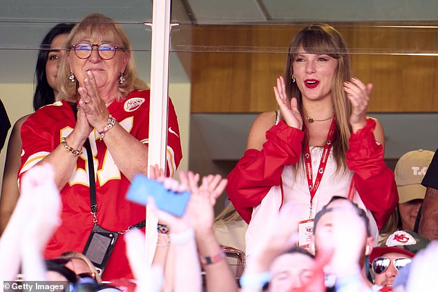 Big fan: During the game, Taylor was spotted enthusiastically cheering on Travis and Kansas City as the Chiefs defeated the Bears 41-10 while catching up with his mother;  seen on Sunday