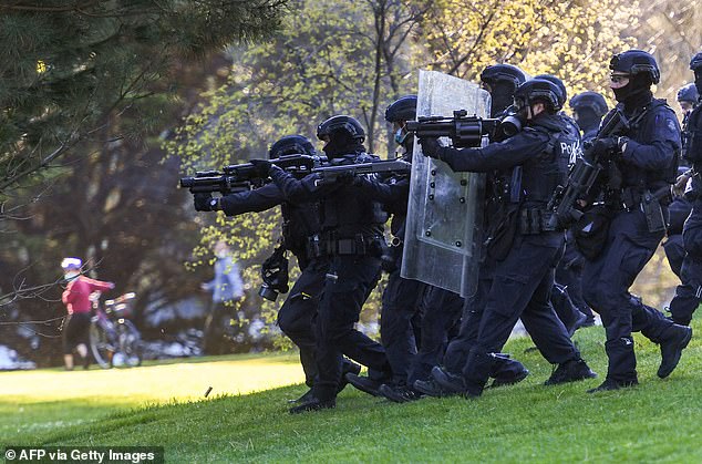 Police attack protesters at Melbourne's Shrine of Remembrance during a protest against Covid-19 regulations in Melbourne on September 22, 2021.