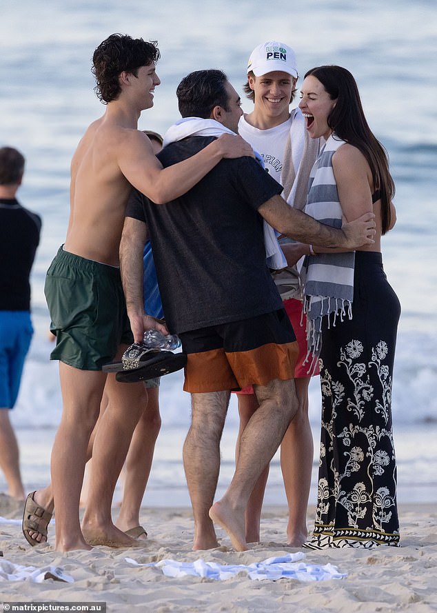 The mum-of-three and her new boyfriend were then spotted chatting and laughing with her sons after they went for a swim