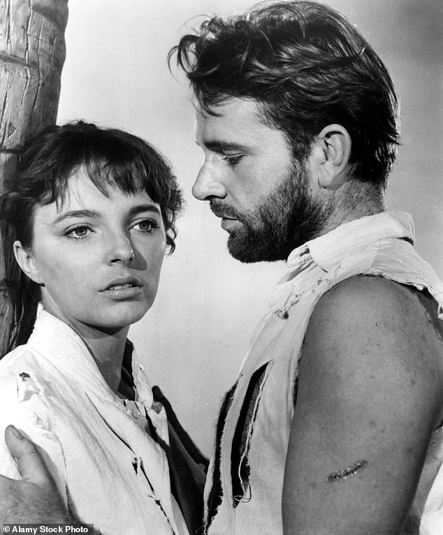 Title: Joan said it used to be worse when actors Richard Burton (pictured with Joan in Sea Wife in 1857) saw it as a 'divine right to sleep with his leading lady'