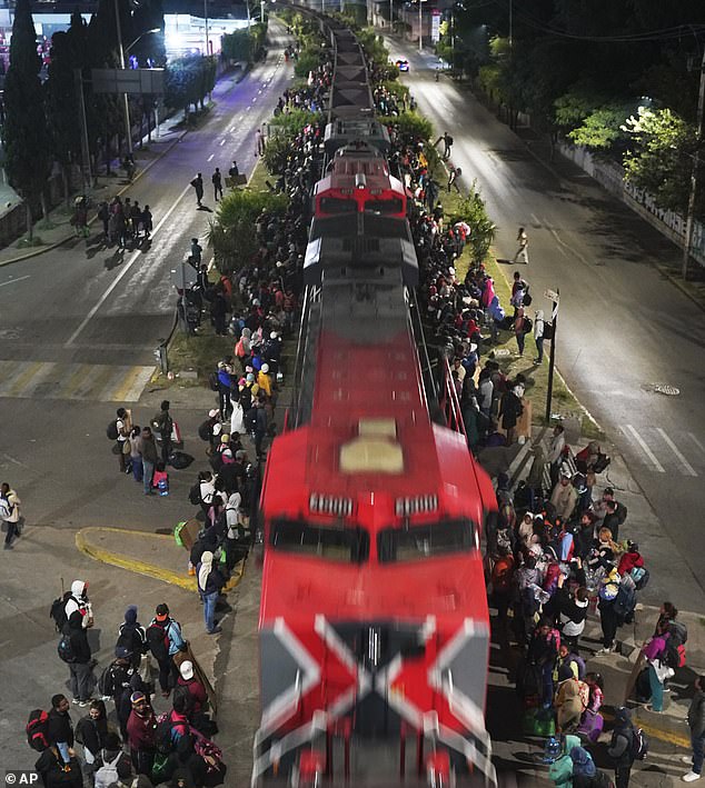 Video shared from central Mexico shows more than 5,000 asylum seekers illegally boarding a freight train to gain entry to the US