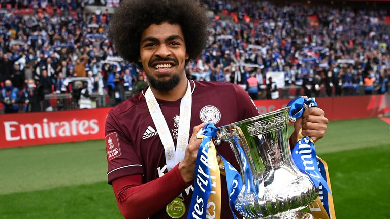     Hamza Choudhury of Leicester City celebrates with the Emirates FA Cup trophy after the Emirates FA Cup final between Chelsea and Leicester City at Wembley Stadium on May 15, 2021 in London, England. 