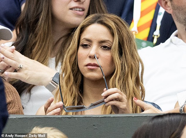 Shakira (pictured at Wimbledon this year) faces a prison sentence of up to eight years if convicted of six charges of tax fraud totaling £12.6 million for which she will stand trial at a Barcelona court from November 20